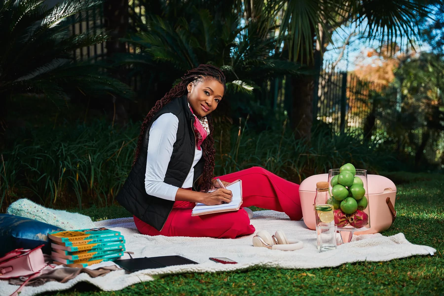 Ndumi Hadebe writing outdoors