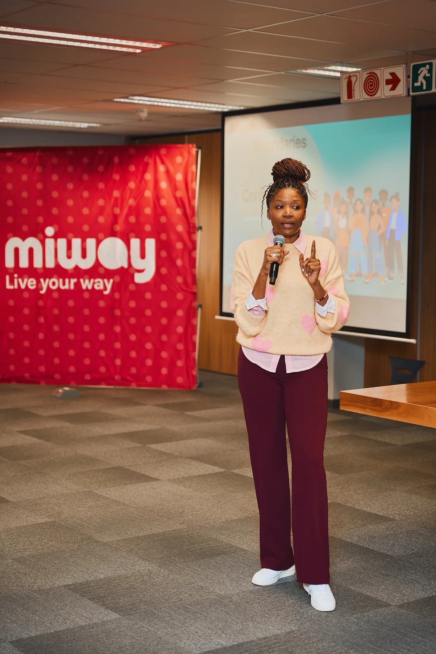 Ndumi Hadebe speaking with a microphone